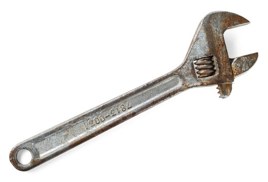 Old rusty adjustable wrench. Variable-size wrench used to rotate nuts, bolts, and other parts,  ideal for plumbing, mechanical repairs.