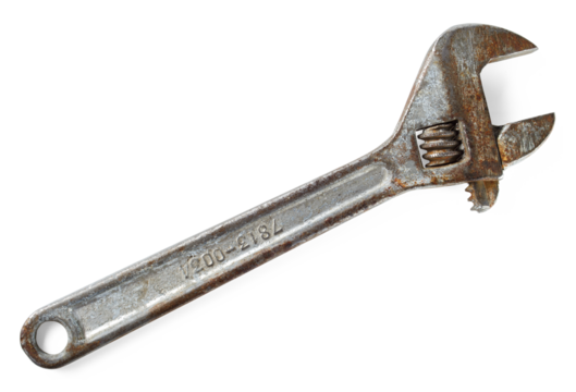 Old rusty adjustable wrench. Variable-size wrench used to rotate nuts, bolts, and other parts,  ideal for plumbing, mechanical repairs.