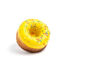 Donut with yellow icing isolated on white background.