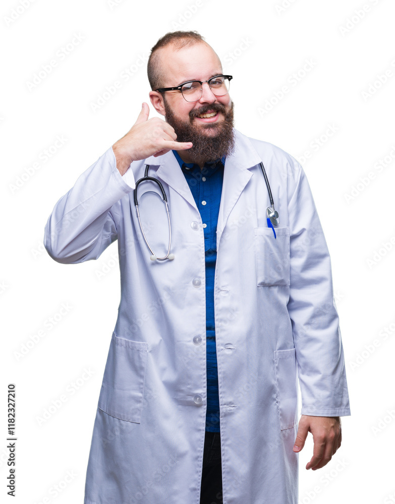 Canvas Prints Young caucasian doctor man wearing medical white coat over isolated background smiling doing phone gesture with hand and fingers like talking on the telephone. Communicating concepts.