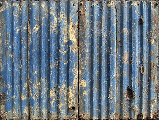 Blue Rusty Corrugated Iron Sheet with Patches of Rust and Wear Marks, Showing a Vintage and Industrial Texture, Suitable for Rustic, Retro, and Industrial Design Themes