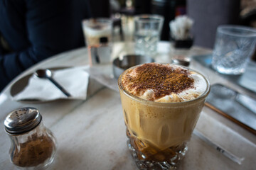 A close up of a cup of coffee on a table in Ioannina, Greece.