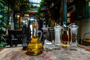 Beautiful restaurant: Bottles of olive oil, salt and pepper in Sarajevo. Bosnia