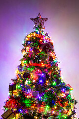Ornamernts on Christmas tree. Christmas tree, boxes with gifts