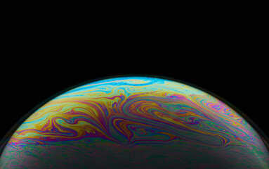 Space abstraction: bright color overflows in the style of soap bubbles. The play of light and textures creates the effect of a planet in the universe. Ideal for concepts of art and futurism.