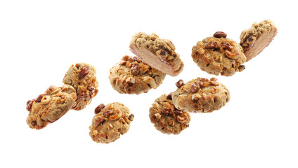 Yummy nut cookies in air on white background