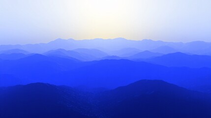 Obraz premium Serene Blue Mountain Range Landscape at Sunset
