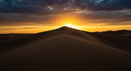 Fototapeta premium Desert sand dune, silhouette against sunset sky, golden hour, dramatic clouds, panoramic landscape, vibrant orange and blue colors, serene atmosphere, vast horizon, nature photography, high contrast, 