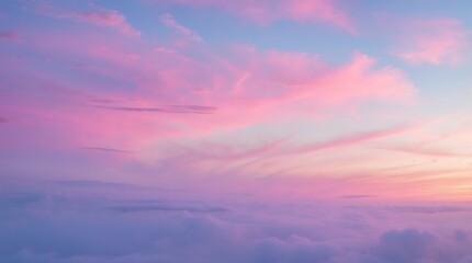 Naklejka premium Pink and Purple Sunset Above the Clouds: A Serene Aerial View