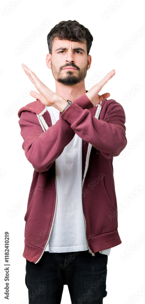 Wall mural Young handsome man over isolated background Rejection expression crossing arms doing negative sign, angry face