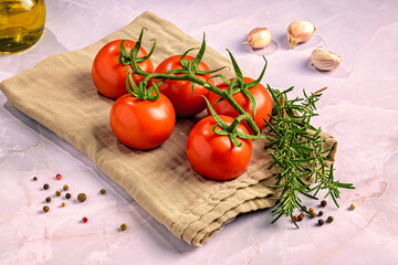 omatoes and Rosemary on Marble Surface