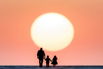 Fototapeta premium A silhouette of a man and two children walking on the beach at sunset