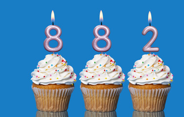 Birthday Cupcakes With Candles Lit Forming The Number 882
