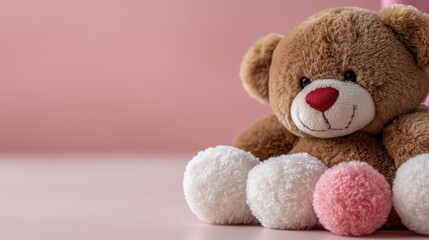 A brown  bear sitting on a pink surface