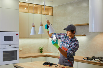 An Electrician is busy Fixing Kitchen Pendant Lights to enhance the interior decor and lighting