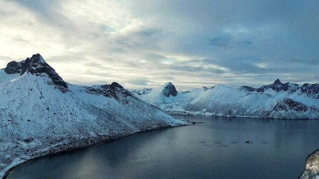 Aerial view of fjord and mountains near Husoy, a village in Norway