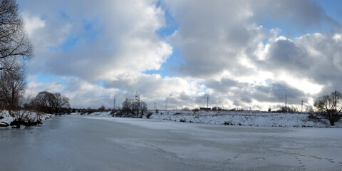 Winter fishing on the lake, beautiful panorama.