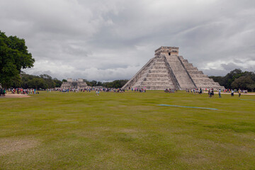 A scenic view of Chichen Itza Pyramid in Mexico under a beautiful cloudy sky