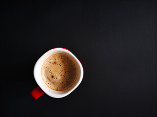 cup of coffee on black background