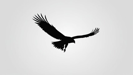 Fototapeta premium Dynamic eagle silhouette mid-air with powerful wings and a strong pose.