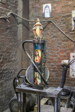 Manshiyat Naser, Garbage City, Cairo, Egypt. A small Christian shrine with machinery.