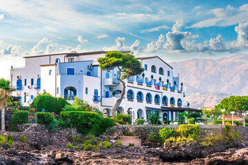 summer beautiful view of nice hotel resort building in greek style on sea coast with amazing...