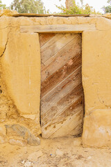 Faiyum, Egypt. Wooden door in a wall.