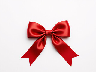 Fototapeta premium Red satin bow on ribbon, elegant and festive, perfect for holiday gift wrapping and decoration.