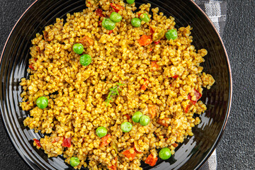 boulgur quinoa dish with vegetables vegetarian dish vegetable food fresh tasty food dish delicious gourmet food background on the table rustic food top view copy space keto and paleo diet