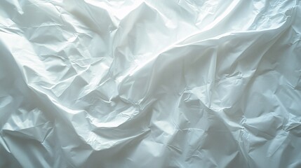 Obraz premium Crumpled white paper revealing subtle textures and shadows in natural light