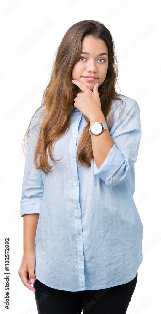 Wall mural Young beautiful brunette business woman over isolated background looking confident at the camera with smile with crossed arms and hand raised on chin. Thinking positive.