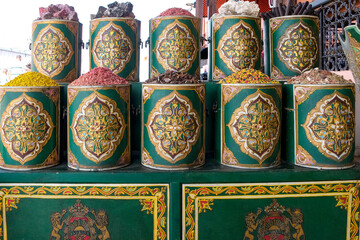 Marrakech, Morocco. Tins of spices for sale in the medina.