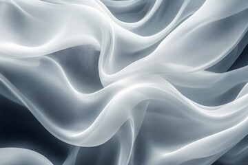 Obraz premium Elegant white transparent fabric flowing on a dark background, creating a beautiful abstract pattern