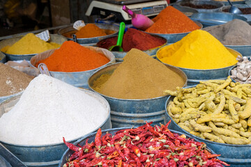 Fes, Morocco. Canisters of spices or sale in the medina