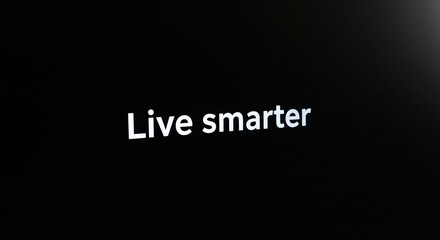 Minimalist 'Live Smarter' Slogan on Black Background - Ideal for Lifestyle and Advertising Themes.