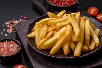 Delicious crispy French fries with salt and spices