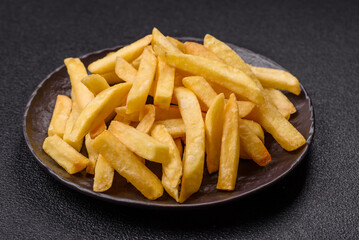 Delicious crispy French fries with salt and spices