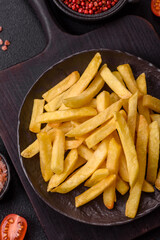 Delicious crispy French fries with salt and spices