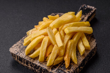Delicious crispy French fries with salt and spices