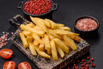 Delicious crispy French fries with salt and spices