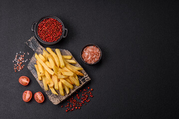 Delicious crispy French fries with salt and spices