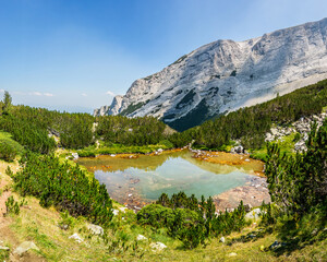 Sukhodolsko lake against Stapalata (Steps) rocks on the Mt. Razlozhsky Sukhodol rib.