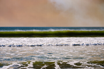 wave breaking in the Pacific Ocean on a windy day in Southern California
