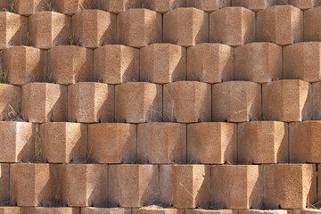 Zaghouan, Tunisia. Wall of stacked landscaping bricks.