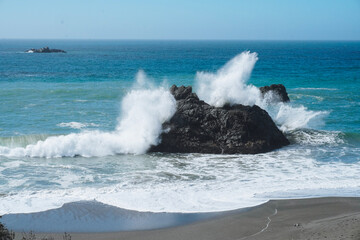 waves crashing on rocks