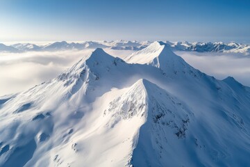 Majestic snow-capped peaks rise above endless clouds in a breathtaking winter landscape