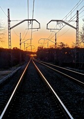 train track at dusk rails bright catenary