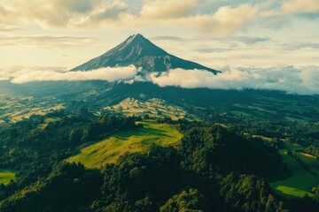 Fototapeta premium Majestic volcanic landscape embraced by lush greenery and wispy clouds at twilight