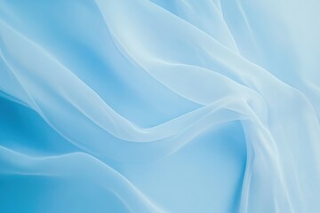 Obraz premium Elegant sheer fabric drapes in soft blue tones create a calming backdrop for creative projects