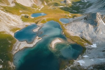 Serene alpine landscape featuring tranquil lakes surrounded by majestic mountains at dusk